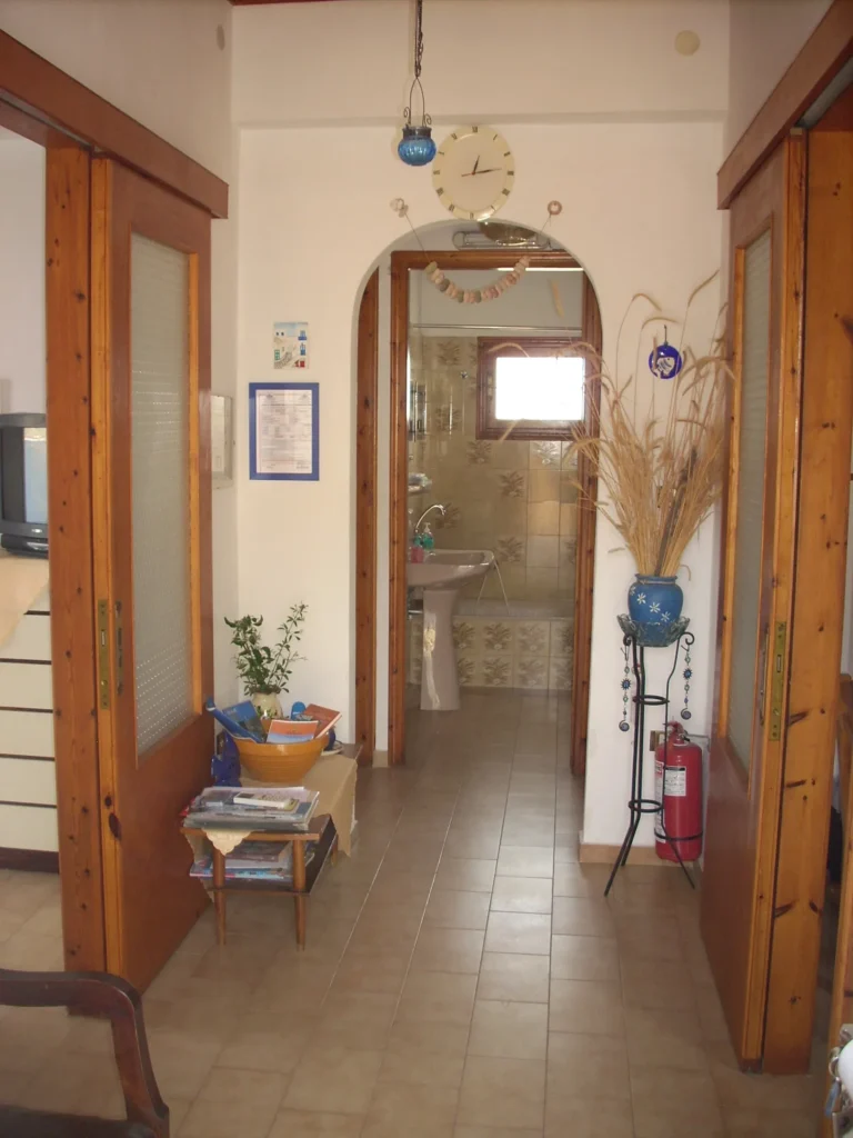 Apartment hallway leading to the bathroom