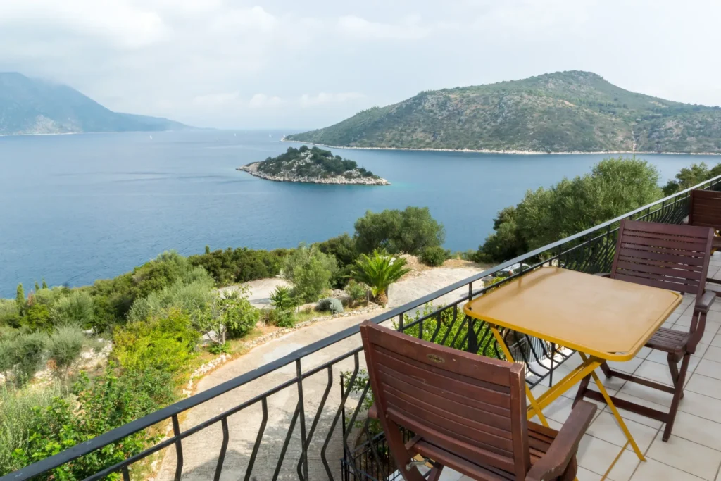 Balcony with table and chairs and sea view