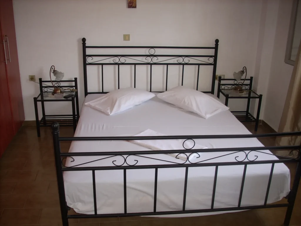 First Floor Apartment: double bedroom with wrought-iron bed