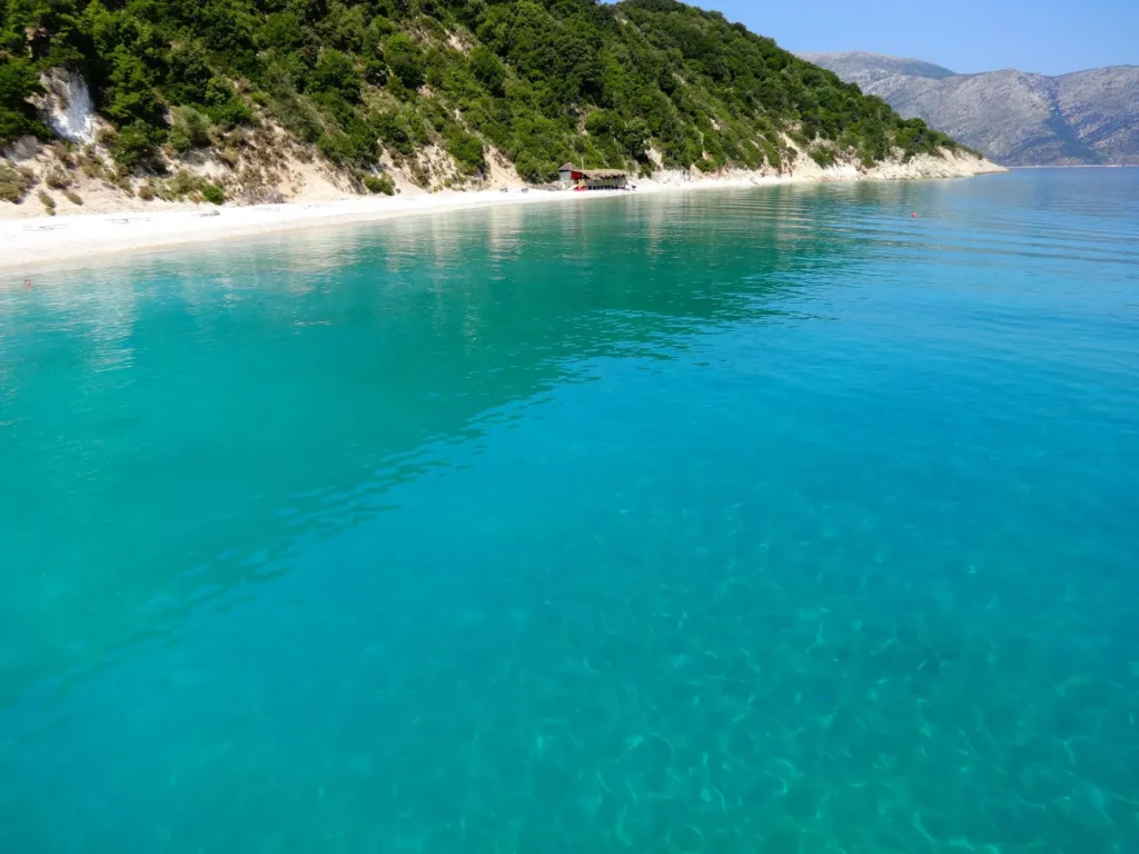 Ithaca beaches: long pebble beach below green hills