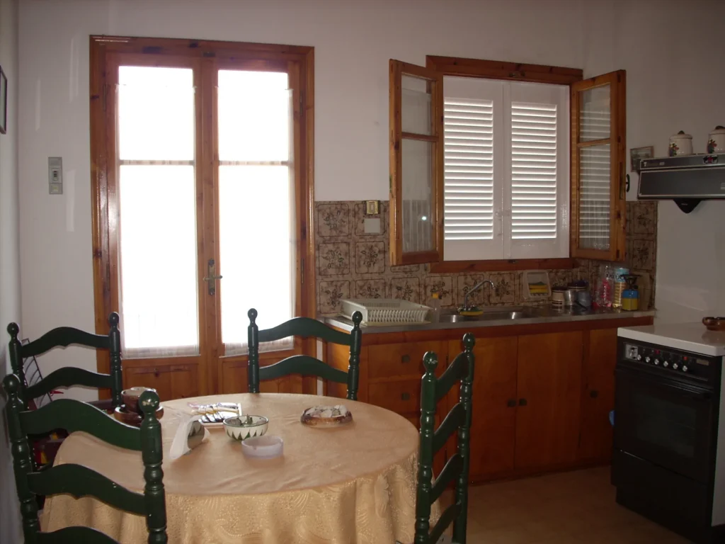 Kitchen and dining area with wooden cabinets