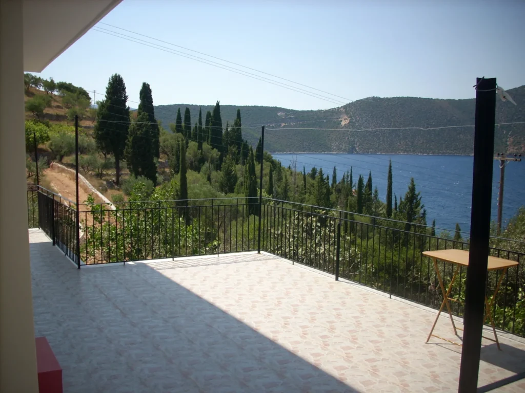 Large balcony with cypress trees and sea view