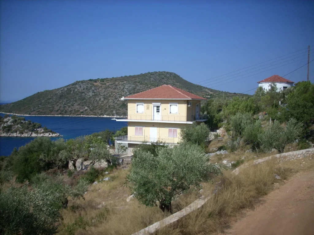 Olympia House among olive trees above the sea in Vathy, Ithaca