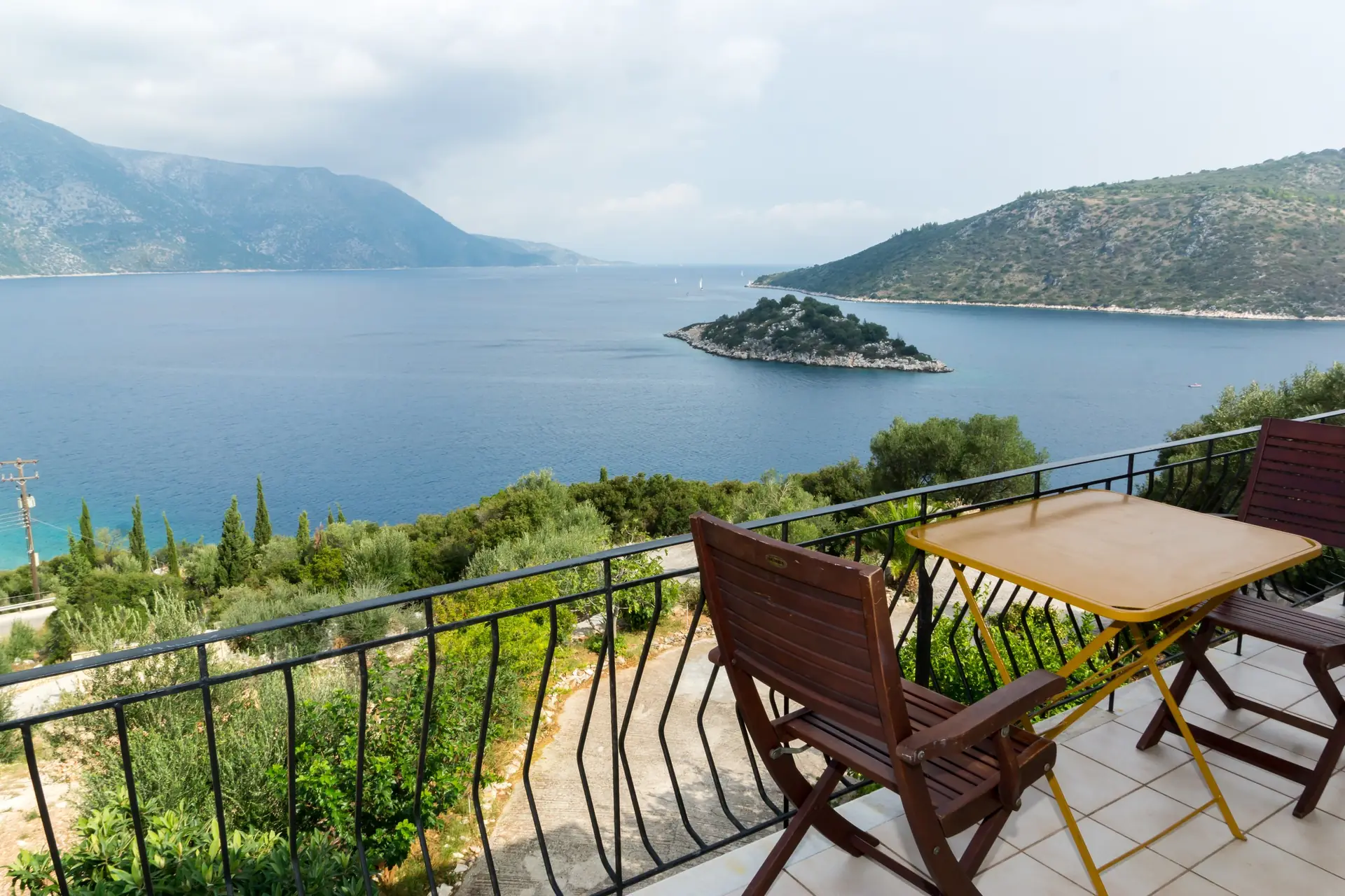 Ithaca accommodation: Olympia House apartments among olive trees above the sea in Vathy