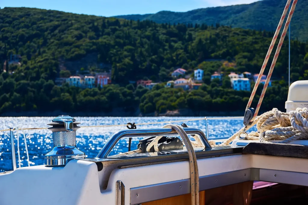Sailing boat in a green bay, the best way to reach hidden Ithaca beaches
