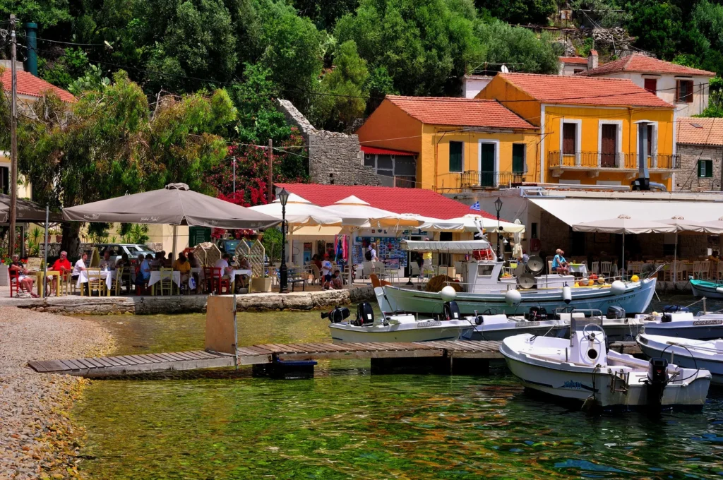 Seaside tavernas and fishing boats in a harbour village, Ithaca